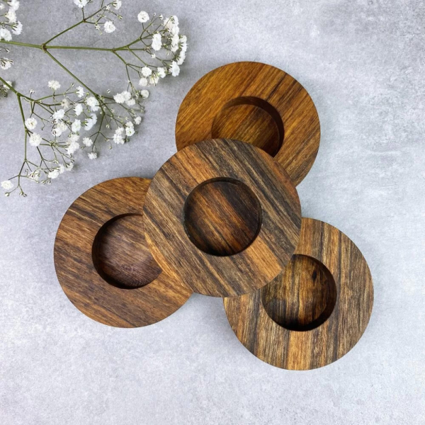 Four wooden exotic tealight candle holders