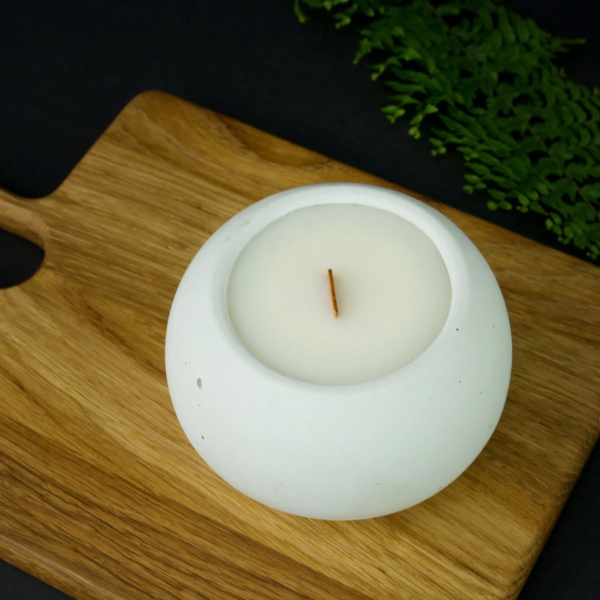 Soy scented candle in concrete